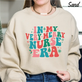 Christmas Gift For Nurse Sweatshirt Nurse Era Christmas Gift Sweatshirt Xmas Nurse cstmzn-chrstms-005 - Physical